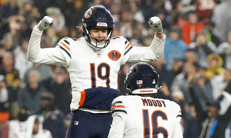 Chicago Bears kicker Jake Moody (16) celebrates with punter Tory Taylor (19) after kicking a game-winning field goal against the Washington Commanders during the fourth quarter at Northwest Stadium. Mandatory Credit: Geoff Burke-Imagn Images