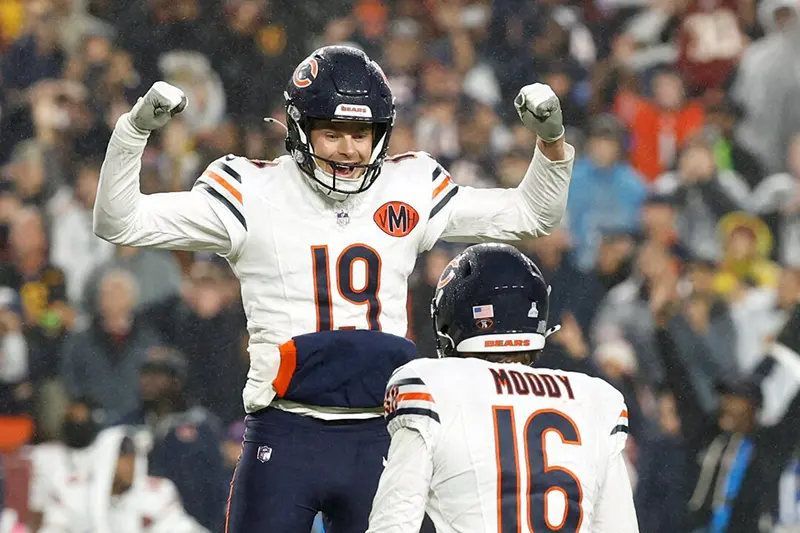 Chicago Bears kicker Jake Moody (16) celebrates with punter Tory Taylor (19) after kicking a game-winning field goal against the Washington Commanders during the fourth quarter at Northwest Stadium. Mandatory Credit: Geoff Burke-Imagn Images