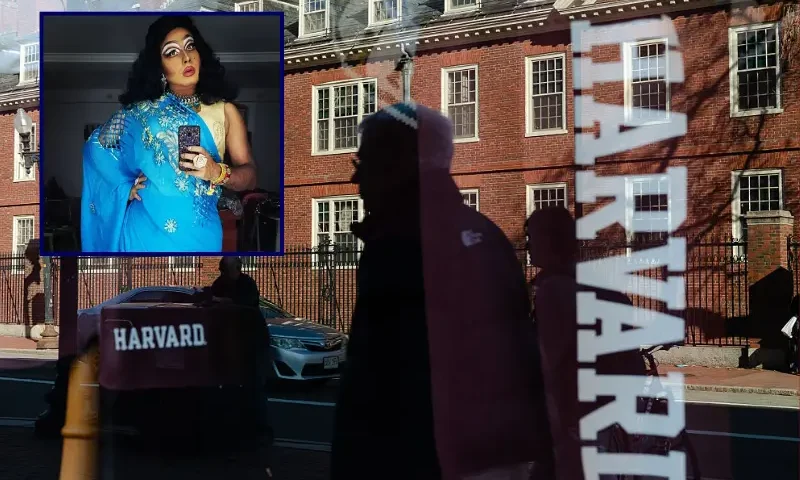 Harvard University is reflected in the window of a merchandise store across the street from the school on April 17, 2025 in Cambridge, Massachusetts. The Trump administration announced that it would block Harvard University from receiving $2.2 billion in federal grants and $60 million in contracts after the school refused demands to adopt new policies relating to student and faculty conduct, admissions, anti-semitism on campus and DEI. (Photo by Sophie Park/Getty Images)