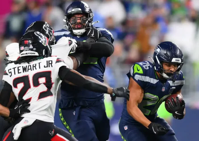 Seattle Seahawks running back Zach Charbonnet (26) runs the ball during the first quarter against the Houston Texans at Lumen Field. Mandatory Credit: Steven Bisig-Imagn Images
