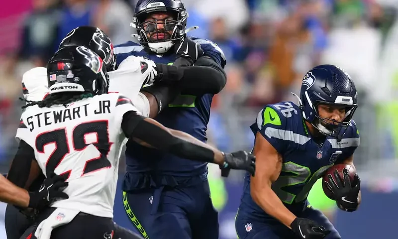 Seattle Seahawks running back Zach Charbonnet (26) runs the ball during the first quarter against the Houston Texans at Lumen Field. Mandatory Credit: Steven Bisig-Imagn Images