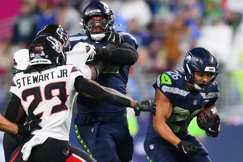 Seattle Seahawks running back Zach Charbonnet (26) runs the ball during the first quarter against the Houston Texans at Lumen Field. Mandatory Credit: Steven Bisig-Imagn Images