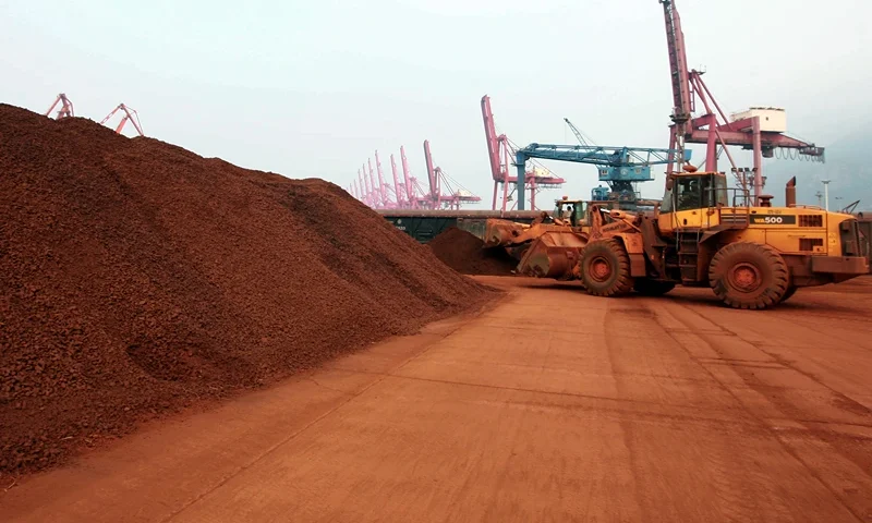 TO GO WITH China-Japan-technology-commodities FOCUS by D'Arcy Doran In a picture taken on September 5, 2010 a man driving a front loader shifts soil containing rare earth minerals to be loaded at a port in Lianyungang, east China's Jiangsu province, for export to Japan. China's restrictions on exports of rare earths are aimed at maximising profit, strengthening its homegrown high-tech companies and forcing other nations to help sustain global supply, experts say. China last year produced 97 percent of the global supply of rare earths -- a group of 17 elements used in high-tech products ranging from flat-screen televisions to iPods to hybrid cars -- but is home to just a third of reserves. CHINA OUT AFP PHOTO (Photo credit should read STR/AFP via Getty Images)