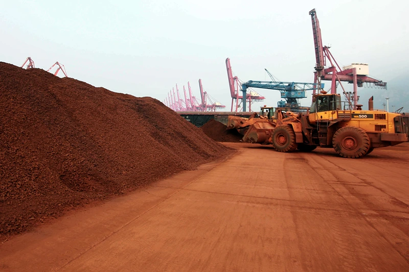TO GO WITH China-Japan-technology-commodities FOCUS by D'Arcy Doran In a picture taken on September 5, 2010 a man driving a front loader shifts soil containing rare earth minerals to be loaded at a port in Lianyungang, east China's Jiangsu province, for export to Japan. China's restrictions on exports of rare earths are aimed at maximising profit, strengthening its homegrown high-tech companies and forcing other nations to help sustain global supply, experts say. China last year produced 97 percent of the global supply of rare earths -- a group of 17 elements used in high-tech products ranging from flat-screen televisions to iPods to hybrid cars -- but is home to just a third of reserves. CHINA OUT AFP PHOTO (Photo credit should read STR/AFP via Getty Images)