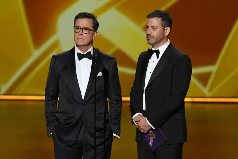 LOS ANGELES, CALIFORNIA - SEPTEMBER 22: (L-R) Stephen Colbert and Jimmy Kimmel speak onstage during the 71st Emmy Awards at Microsoft Theater on September 22, 2019 in Los Angeles, California. (Photo by Kevin Winter/Getty Images)