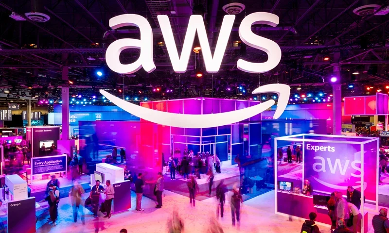 LAS VEGAS, NEVADA - NOVEMBER 28: Attendees walk through an expo hall at AWS re:Invent 2023, a conference hosted by Amazon Web Services, at The Venetian Las Vegas on November 28, 2023 in Las Vegas, Nevada. (Photo by Noah Berger/Getty Images for Amazon Web Services)