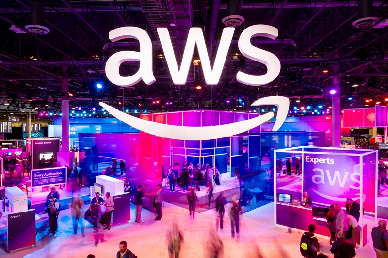 LAS VEGAS, NEVADA - NOVEMBER 28: Attendees walk through an expo hall at AWS re:Invent 2023, a conference hosted by Amazon Web Services, at The Venetian Las Vegas on November 28, 2023 in Las Vegas, Nevada. (Photo by Noah Berger/Getty Images for Amazon Web Services)