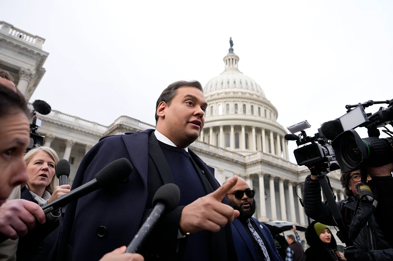 WASHINGTON, DC - DECEMBER 01: Rep. George Santos (R-NY) is surrounded by journalists as he leaves the U.S. Capitol after his fellow members of Congress voted to expel him from the House of Representatives on December 01, 2023 in Washington, DC. Charged by the U.S. Department of Justice with 23 felonies in New York including fraud and campaign finance violations, Santos, 35, was expelled from the House of Representatives by a vote of 311-114. Santos is only the sixth person in U.S. history to be expelled from the House of Representatives. (Photo by Drew Angerer/Getty Images)