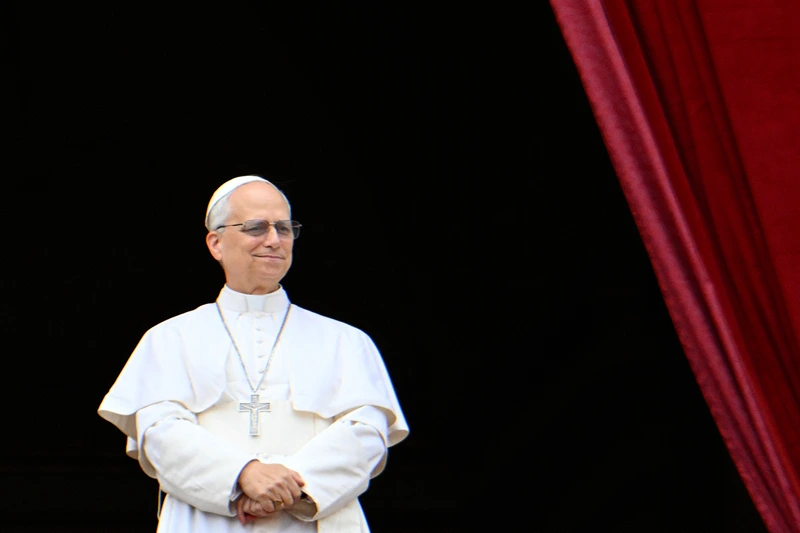 Pope Leo XIV greets the crowd after the Regina Caeli prayer from the main central loggia balcony of St Peter's basilica in The Vatican, on May 11, 2025. (Photo by Alberto PIZZOLI / AFP) (Photo by ALBERTO PIZZOLI/AFP via Getty Images)