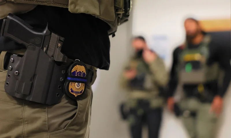 NEW YORK, NEW YORK - JUNE 10: An ICE officers badge is seen as federal agents patrol the halls of immigration court at the Jacob K. Javitz Federal Building on June 10, 2025 in New York City. Federal agents are arresting immigrants during mandatory check-ins, as ICE ramps up enforcement following immigration court hearings. The Trump administration has ordered officials to increase detentions to 3,000 migrants per day. (Photo by Michael M. Santiago/Getty Images)