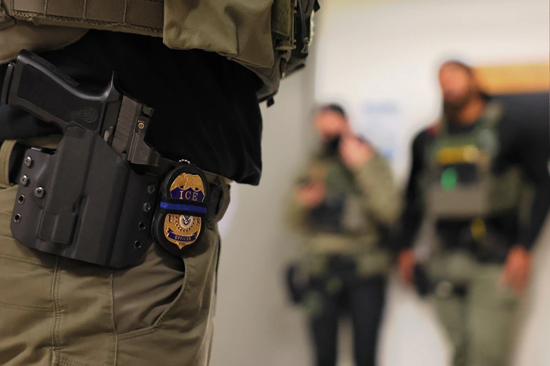 NEW YORK, NEW YORK - JUNE 10: An ICE officers badge is seen as federal agents patrol the halls of immigration court at the Jacob K. Javitz Federal Building on June 10, 2025 in New York City. Federal agents are arresting immigrants during mandatory check-ins, as ICE ramps up enforcement following immigration court hearings. The Trump administration has ordered officials to increase detentions to 3,000 migrants per day. (Photo by Michael M. Santiago/Getty Images)