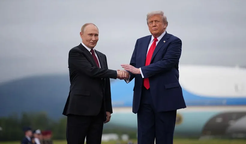 ANCHORAGE, ALASKA - AUGUST 15: U.S. President Donald Trump (R) greets Russian President Vladimir Putin as he arrives at Joint Base Elmendorf-Richardson on August 15, 2025 in Anchorage, Alaska. The two leaders are meeting for peace talks aimed at ending the war in Ukraine. (Photo by Andrew Harnik/Getty Images)