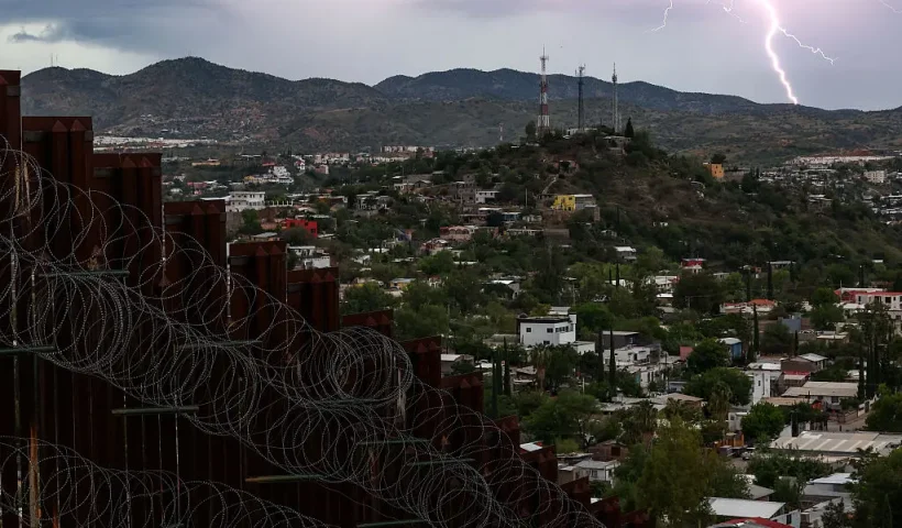 View of the US-Mexico border wall in Nogales, Arizona on September 17, 2025. As of 2022, approximately 11 million people lived in the United States illegally, according to government figures. And this figure may have risen since then to as many as 14 million, according to the Washington-based Migration Policy Institute. Undocumented workers paid $97 billion in taxes in 2022 alone, according to Americans for Tax Fairness. Figures from 2024 from the US Labor Department said nearly half of the foreign-born workforce in America is Latino. (Photo by CHARLY TRIBALLEAU / AFP) (Photo by CHARLY TRIBALLEAU/AFP via Getty Images)