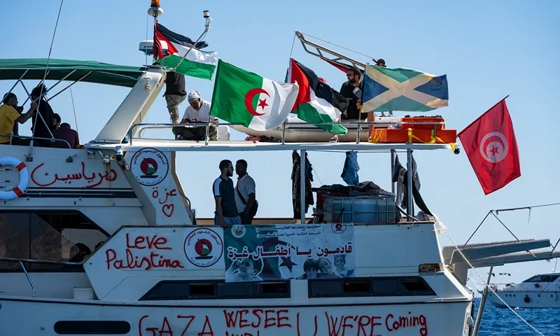 Members of the group of ships of the Global Sumud Flotilla to Gaza are seen moored at the small island of Koufonisi, south of the island of Crete, on September 26, 2025. After a reported attack by drones early on September 25, 2025 morning, Athens has said it will guarantee safe sailing in its waters. The Global Sumud Flotilla, carrying activists including Swedish environmentalist Greta Thunberg, blamed Israel for more than a dozen explosions heard around its vessels off Greece late on September 24, 2025. (Photo by Eleftherios ELIS / AFP) (Photo by ELEFTHERIOS ELIS/AFP via Getty Images)
