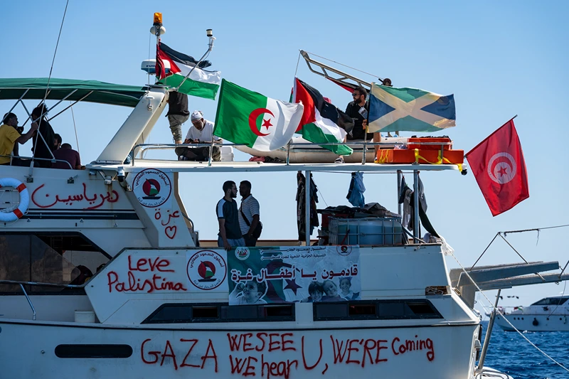 Members of the group of ships of the Global Sumud Flotilla to Gaza are seen moored at the small island of Koufonisi, south of the island of Crete, on September 26, 2025. After a reported attack by drones early on September 25, 2025 morning, Athens has said it will guarantee safe sailing in its waters. The Global Sumud Flotilla, carrying activists including Swedish environmentalist Greta Thunberg, blamed Israel for more than a dozen explosions heard around its vessels off Greece late on September 24, 2025. (Photo by Eleftherios ELIS / AFP) (Photo by ELEFTHERIOS ELIS/AFP via Getty Images)
