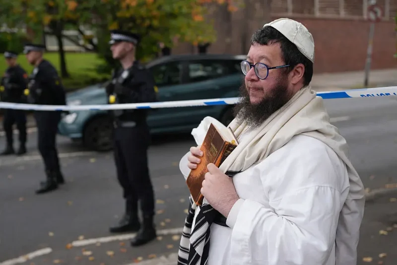 MANCHESTER, ENGLAND - OCTOBER 2: Police block off White House avenue near the scene of the attack following a stabbing and car attack that killed two, on October 2, 2025 in the Crumpsall suburb of Manchester, England. Greater Manchester Police said they were called to the scene shortly after 9:30 AM, when a witness said the assailant drove a car at people and then stabbed someone. Police then shot the suspected attacker. (Photo by Christopher Furlong/Getty Images)