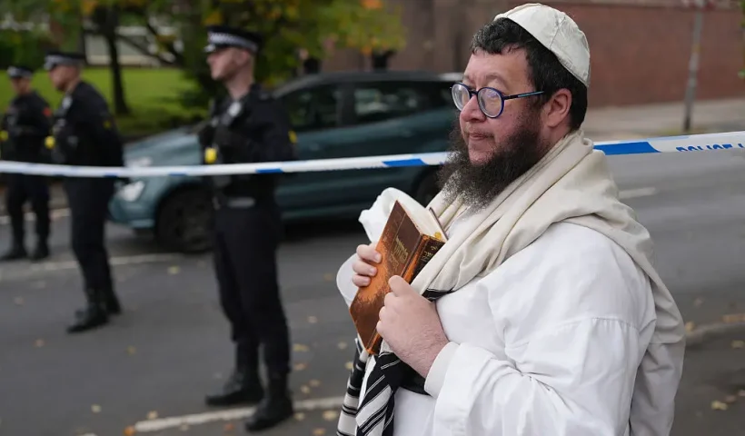 MANCHESTER, ENGLAND - OCTOBER 2: Police block off White House avenue near the scene of the attack following a stabbing and car attack that killed two, on October 2, 2025 in the Crumpsall suburb of Manchester, England. Greater Manchester Police said they were called to the scene shortly after 9:30 AM, when a witness said the assailant drove a car at people and then stabbed someone. Police then shot the suspected attacker. (Photo by Christopher Furlong/Getty Images)