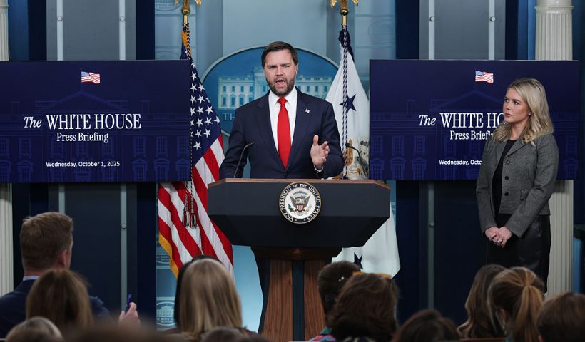 WASHINGTON, DC - OCTOBER 01: U.S. Vice President JD Vance speaks as White House Press Secretary Karoline Leavitt (R) looks on during the daily press briefing in the Brady Press Briefing Room at the White House on October 01, 2025 in Washington, DC. Vance joined Leavitt to discuss the federal government shutdown, after Congress and the White House failed to reach a funding deal by the October 1 deadline and halted U.S. government services for the first time in nearly seven years. (Photo by Alex Wong/Getty Images)