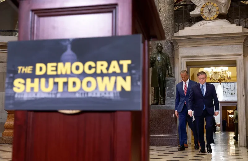 WASHINGTON, DC - OCTOBER 03: U.S. Speaker of the House Mike Johnson (R-LA) and Senate Majority Leader John Thune (R-SD) arrive for a news conference in Statuary Hall at the U.S. Capitol Building on October 3, 2025 in Washington, DC. The federal government shut down early Wednesday after Congress and the White House failed to reach a funding deal. (Photo by Kevin Dietsch/Getty Images)