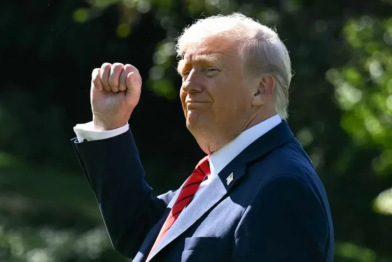 TOPSHOT - US President Donald Trump gestures as he walks to Marine One on the South Lawn of the White House in Washington, DC, on October 10, 2025, on his way to Walter Reed National Military Medical Center to receive a medical checkup. (Photo by SAUL LOEB / AFP) (Photo by SAUL LOEB/AFP via Getty Images)