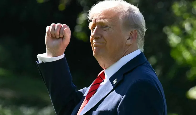 TOPSHOT - US President Donald Trump gestures as he walks to Marine One on the South Lawn of the White House in Washington, DC, on October 10, 2025, on his way to Walter Reed National Military Medical Center to receive a medical checkup. (Photo by SAUL LOEB / AFP) (Photo by SAUL LOEB/AFP via Getty Images)