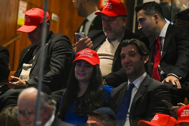 JERUSALEM - OCTOBER 13: People wearing caps tcap read "Trump The Peace President" before President Donald Trump speaks to the Knesset, Israel's parliament, on October 13, 2025 in Jerusalem. President Trump is visiting the country hours after Hamas released the remaining Israeli hostages captured on Oct. 7, 2023, part of a US-brokered ceasefire deal to end the war in Gaza. (Photo by Kenny Holston - Pool/Getty Images)