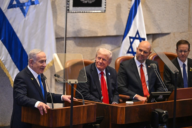 JERUSALEM - OCTOBER 13: (L-R) Prime Minister of Israel Benjamin Netanyahu speaks next to US President Donald Trump, Knesset Speaker Amir Ohana and Israel's President Isaac Herzog at the Knesset, Israel's parliament, on October 13, 2025 in Jerusalem. President Trump is visiting the country hours after Hamas released the remaining Israeli hostages captured on Oct. 7, 2023, part of a US-brokered ceasefire deal to end the war in Gaza. (Photo by Kenny Holston - Pool/Getty Images)