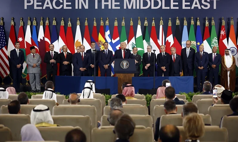 US President Donald Trump (C) delivers a statement during a summit on Gaza in Sharm el-Sheikh on October 13, 2025. US President Donald Trump hailed a "tremendous day for the Middle East" as he and regional leaders signed a declaration on October 13, 2025 meant to cement a ceasefire in Gaza, hours after Israel and Hamas exchanged hostages and prisoners. (Photo by Yoan VALAT / POOL / AFP) (Photo by YOAN VALAT/POOL/AFP via Getty Images)
