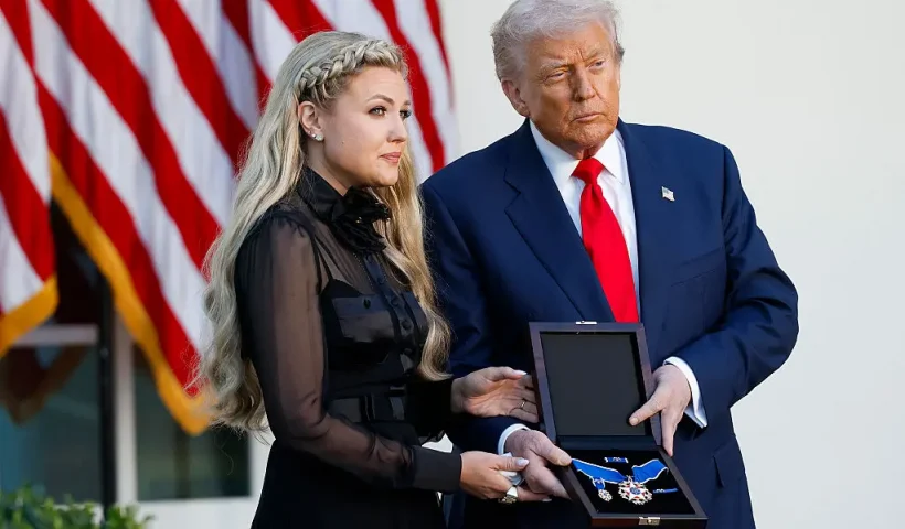 WASHINGTON, DC - OCTOBER 14: U.S. President Donald Trump posthumously awards the Presidential Medal of Freedom to late conservative activist Charlie Kirk as he presents the Medal to his wife Erika Kirk (L) during a ceremony in the Rose Garden of the White House on October 14, 2025 in Washington, DC. Today marks the National Day of Remembrance for Charlie Kirk who was shot and killed on September 10th at Utah Valley University. (Photo by Kevin Dietsch/Getty Images)