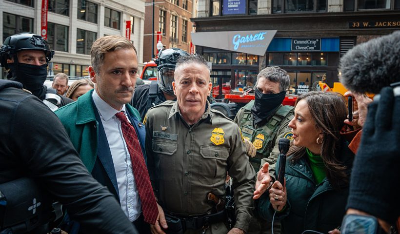 CHICAGO, ILLINOIS - OCTOBER 28: U.S. Border Patrol commander Gregory Bovino pushes through a crowd of media and protesters as he enters the Dirksen Federal Building on October 28, 2025, in Chicago, Illinois. Bovino is appearing before U.S. District Judge Sara Ellis amid accusations that he and agents under his command have defied court limits on tear gas and other crowd control tactics during President Donald Trump's Operation Midway Blitz enforcement surge across Chicago and the suburbs. (Photo by Jamie Kelter Davis/Getty Images)