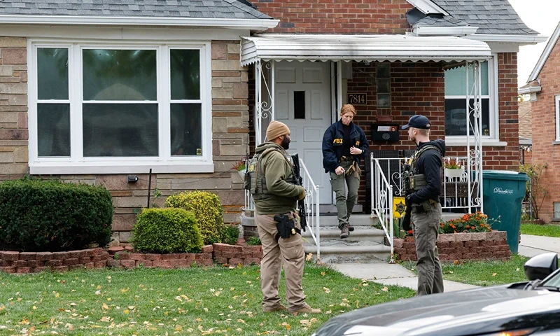 Members of the FBI Joint Terrorism Task Force search a home in Dearborn, Michigan, on October 31, 2025. FBI Director Kash Patel said Friday that the agency had thwarted a "potential terrorist attack" planned in the northern state of Michigan over Halloween weekend. Patel said the FBI arrested multiple subjects. (Photo by JEFF KOWALSKY / AFP) (Photo by JEFF KOWALSKY/AFP via Getty Images)