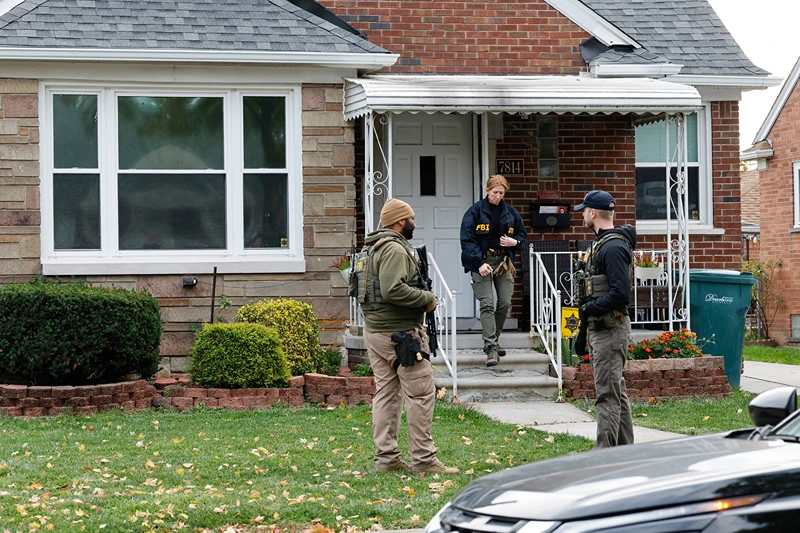 Members of the FBI Joint Terrorism Task Force search a home in Dearborn, Michigan, on October 31, 2025. FBI Director Kash Patel said Friday that the agency had thwarted a "potential terrorist attack" planned in the northern state of Michigan over Halloween weekend. Patel said the FBI arrested multiple subjects. (Photo by JEFF KOWALSKY / AFP) (Photo by JEFF KOWALSKY/AFP via Getty Images)