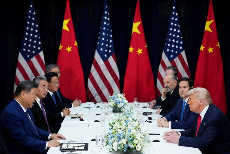 BUSAN, SOUTH KOREA - OCTOBER 30: U.S. President Donald Trump (R) speaks with Chinese President Xi Jinping during a bilateral meeting at Gimhae Air Base on October 30, 2025 in Busan, South Korea. Trump is meeting Xi for the first time since taking office for his second term, following months of growing tension between both countries. (Photo by Andrew Harnik/Getty Images)