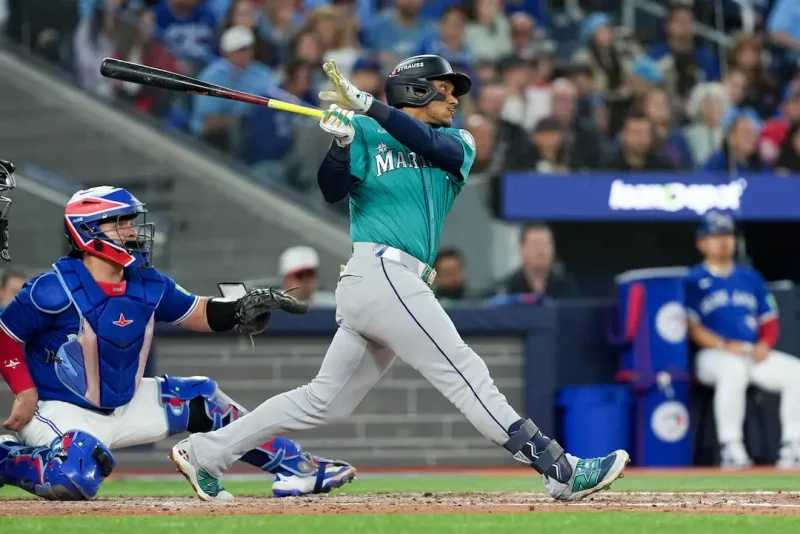 Seattle Mariners infielder Jorge Polanco (7) hits a three run home run in the fifth inning against the Toronto Blue Jays during game two of the ALCS round for the 2025 MLB playoffs at Rogers Centre. Mandatory Credit: Nick Turchiaro-Imagn Images