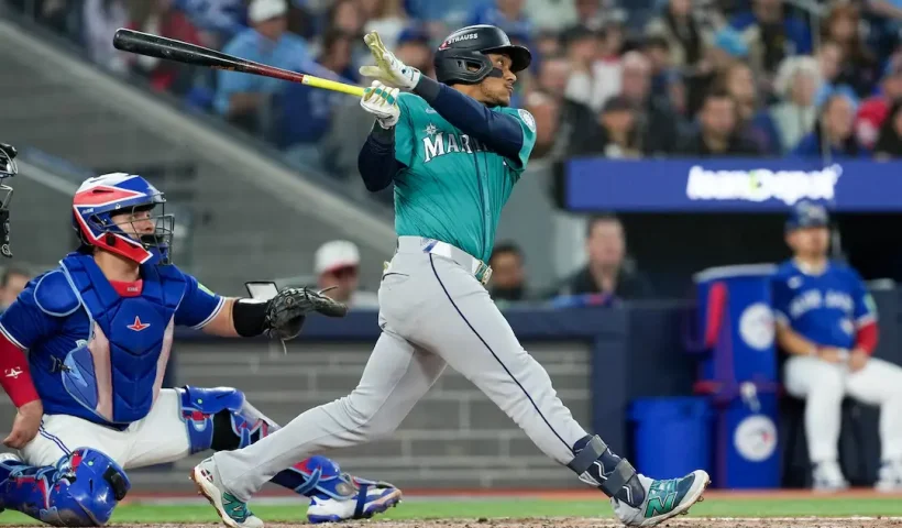 Seattle Mariners infielder Jorge Polanco (7) hits a three run home run in the fifth inning against the Toronto Blue Jays during game two of the ALCS round for the 2025 MLB playoffs at Rogers Centre. Mandatory Credit: Nick Turchiaro-Imagn Images