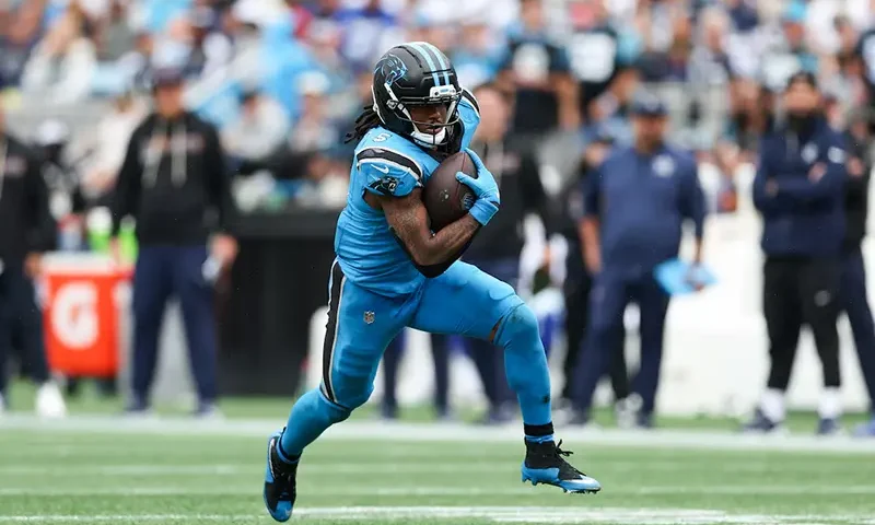 Carolina Panthers running back Rico Dowdle (5) runs with the ball during the second half against the Dallas Cowboys at Bank of America Stadium. Mandatory Credit: Cory Knowlton-Imagn Images