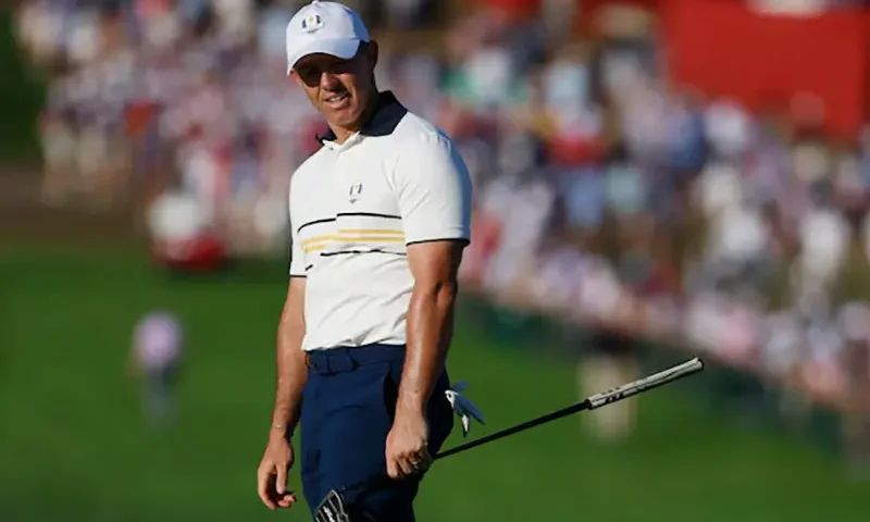Team Europe's Rory McIlroy reacts after his putt on the 18th hole during the singles IMAGN IMAGES via Reuters/Peter Casey
