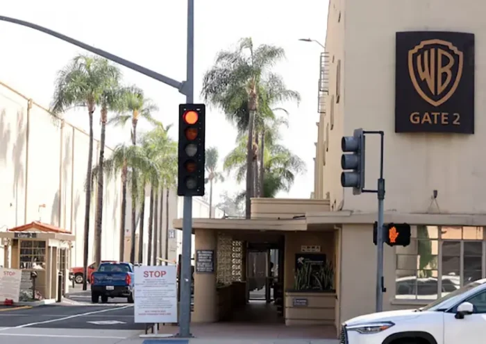 A vehicle drives through gate 2 at Warner Bros. Studios in Burbank, California, U.S., September 25, 2023. REUTERS/Mario Anzuoni