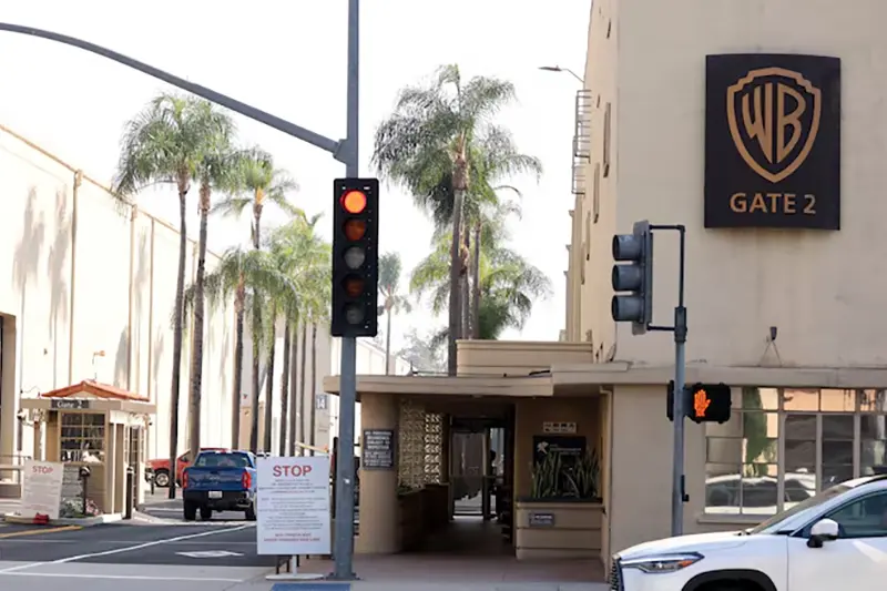 A vehicle drives through gate 2 at Warner Bros. Studios in Burbank, California, U.S., September 25, 2023. REUTERS/Mario Anzuoni