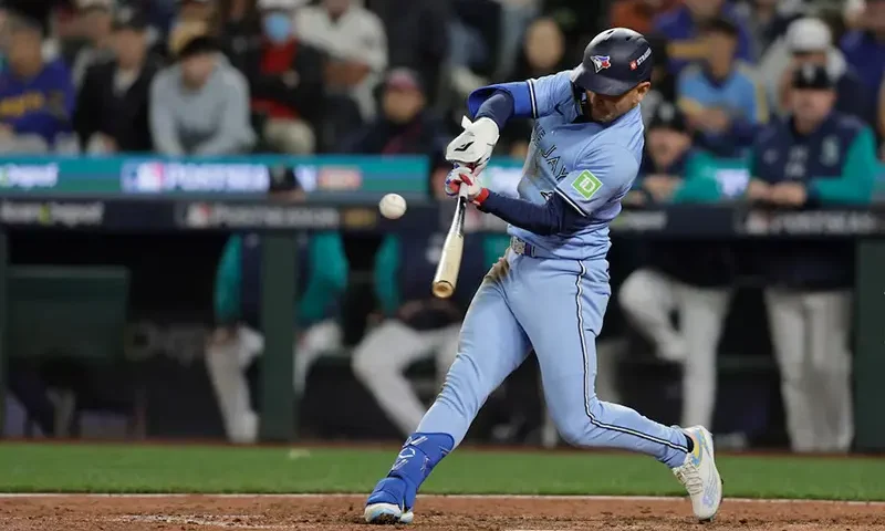 Toronto Blue Jays second baseman Andres Gimenez (0) singles in the seventh inning against the Seattle Mariners during game three of the ALCS round for the 2025 MLB playoffs at T-Mobile Park. Mandatory Credit: John Froschauer-Imagn Images