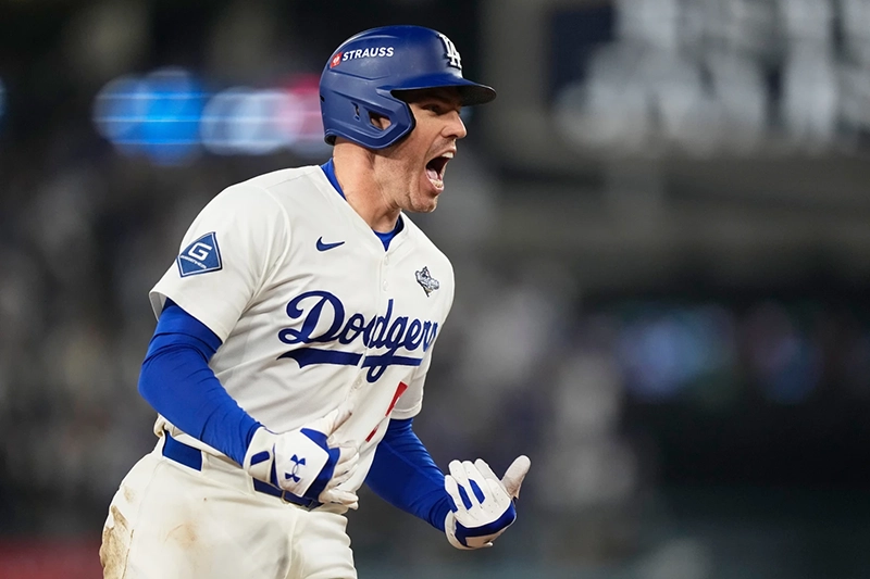 Los Angeles Dodgers’ Freddie Freeman celebrates his walk off home run against the Toronto Blue Jays during the 18th inning in Game 3 of baseball’s World Series, Monday, Oct. 27, 2025, in Los Angeles.(AP Photo/Brynn Anderson)