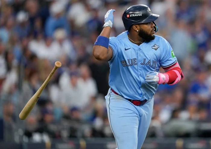 Toronto Blue Jays’ Vladimir Guerrero Jr. flips his bat after hitting a two run against the Los Angeles Dodgers during the third inning in Game 4 of baseball’s World Series, Tuesday, Oct. 28, 2025, in Los Angeles. (AP Photo/Ashley Landis)