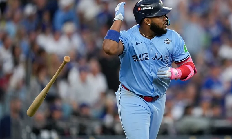 Toronto Blue Jays’ Vladimir Guerrero Jr. flips his bat after hitting a two run against the Los Angeles Dodgers during the third inning in Game 4 of baseball’s World Series, Tuesday, Oct. 28, 2025, in Los Angeles. (AP Photo/Ashley Landis)