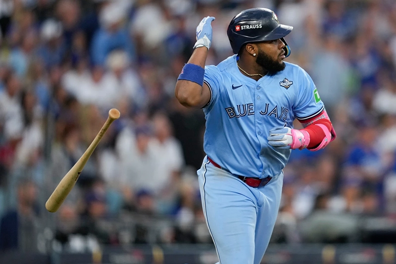 Toronto Blue Jays’ Vladimir Guerrero Jr. flips his bat after hitting a two run against the Los Angeles Dodgers during the third inning in Game 4 of baseball’s World Series, Tuesday, Oct. 28, 2025, in Los Angeles. (AP Photo/Ashley Landis)