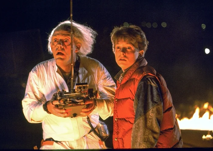 This image released by Universal Pictures shows Christopher Lloyd, left, and Michael J. Fox in a scene from the 1985 film “Back to the Future.” (Universal Pictures via AP)