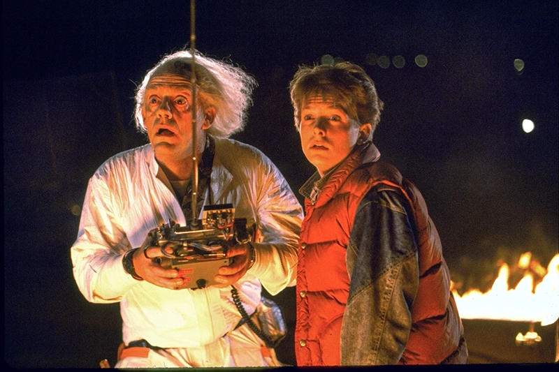 This image released by Universal Pictures shows Christopher Lloyd, left, and Michael J. Fox in a scene from the 1985 film “Back to the Future.” (Universal Pictures via AP)