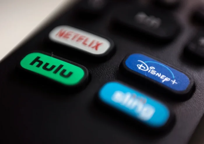 The logos for streaming services Netflix, Hulu, Disney Plus and Sling TV are pictured on a remote control on Aug. 13, 2020, in Portland, Ore. (AP Photo/Jenny Kane, File)