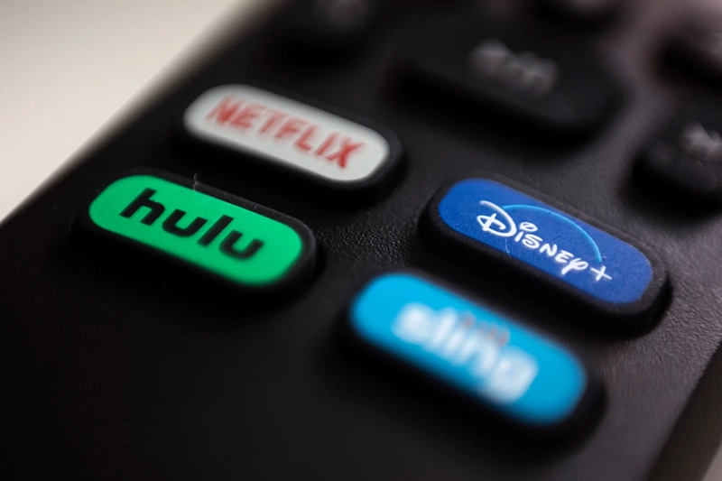 The logos for streaming services Netflix, Hulu, Disney Plus and Sling TV are pictured on a remote control on Aug. 13, 2020, in Portland, Ore. (AP Photo/Jenny Kane, File)