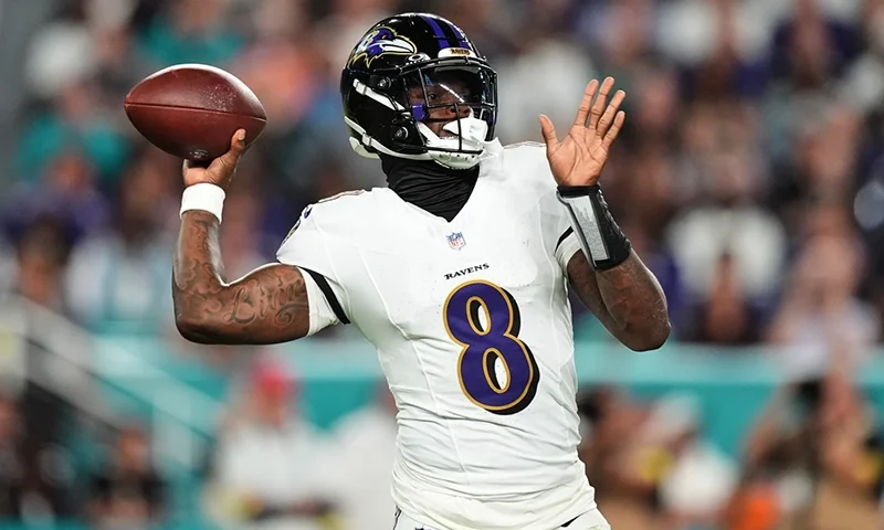 Baltimore Ravens quarterback Lamar Jackson (8) throws against the Miami Dolphins during the first half of an NFL football game, Thursday, Oct. 30, 2025, in Miami Gardens, Fla. (AP Photo/Rebecca Blackwell)