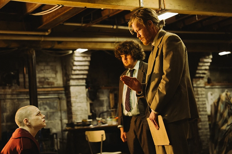 This image released by Focus Features shows Emma Stone, from left, Aidan Delbis, and Jesse Plemons in a scene from “Bugonia.” (Atsushi Nishijima/Focus Features via AP)